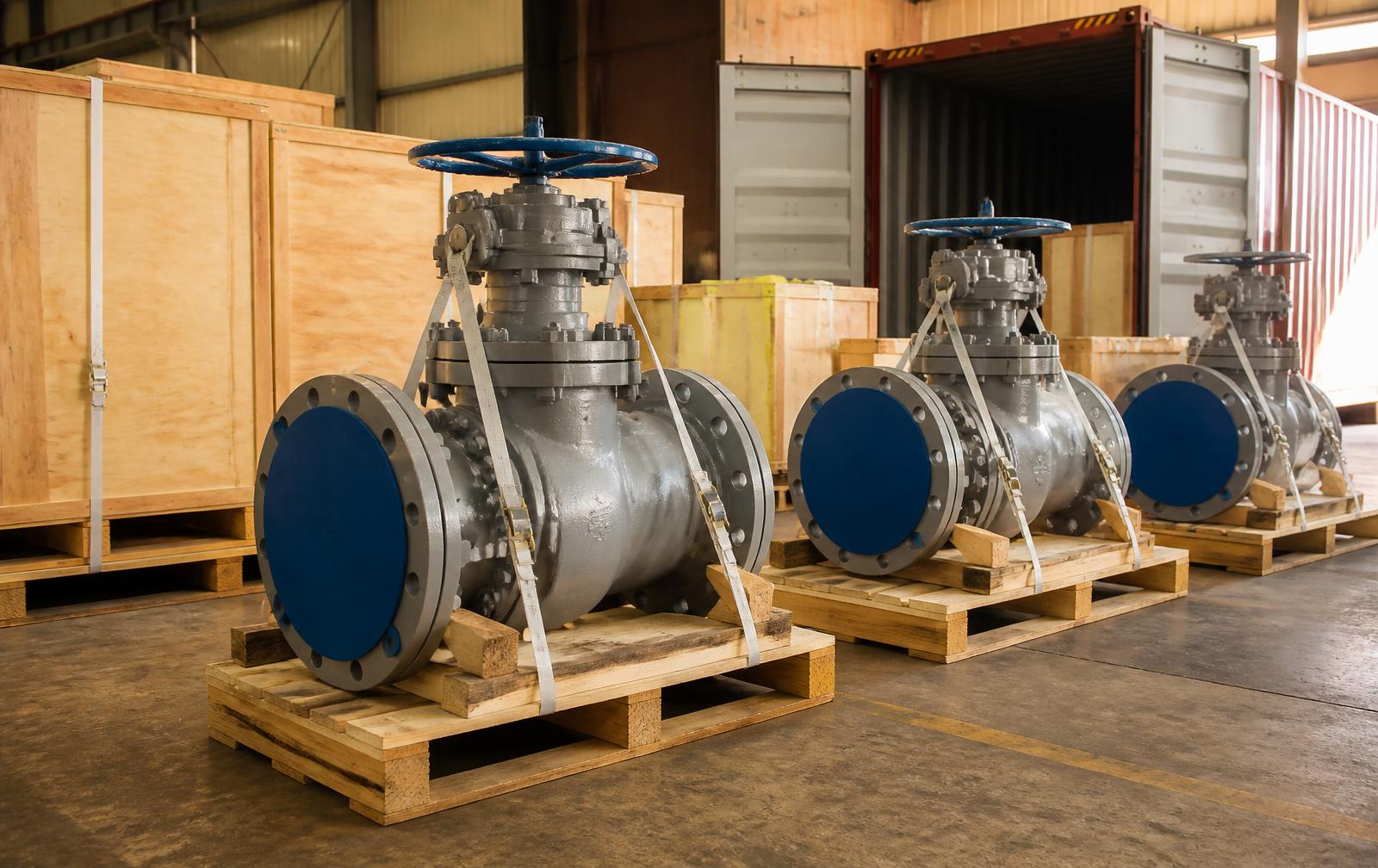 Crated valves stencilled for export being loaded at the Nashik dispatch bay
